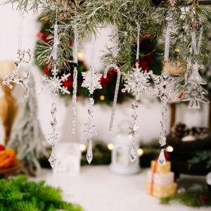 18 piece glittering acrylic christmas ornament set with assorted festive shapes like reindeer snowflake and candy cane